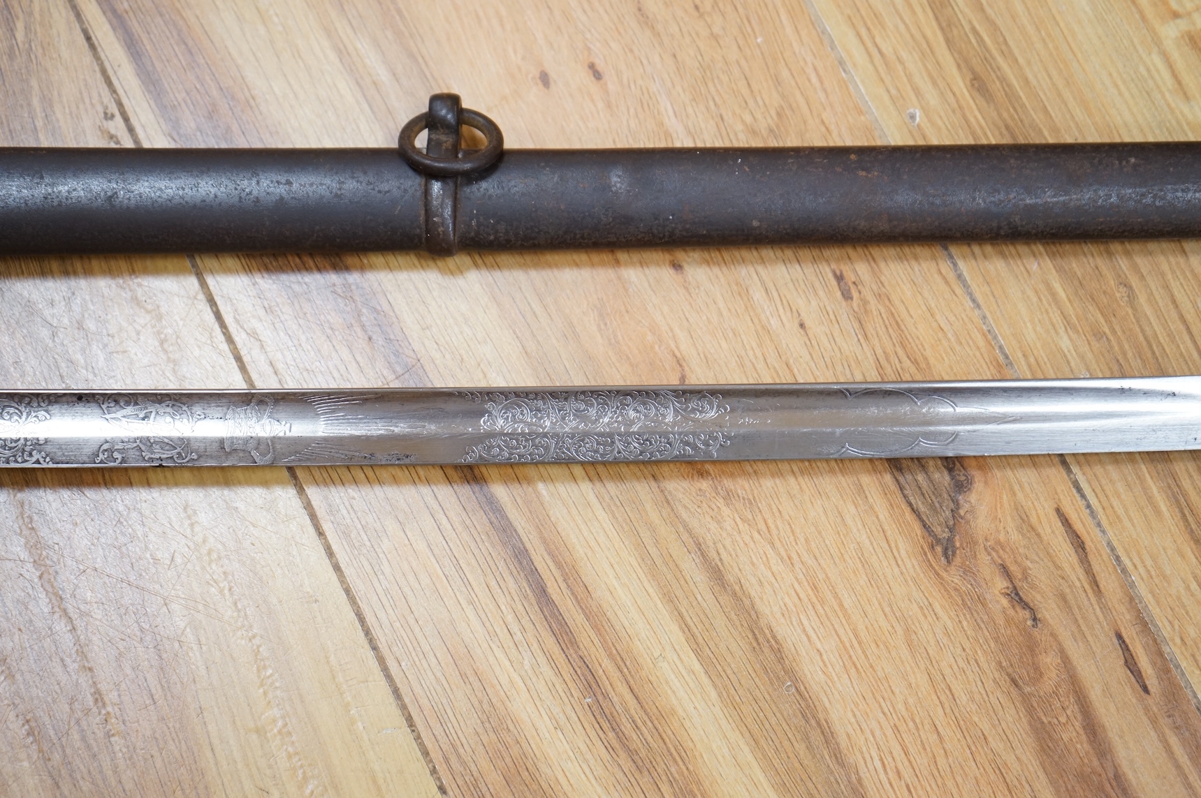 A Victorian 1845 pattern infantry officer’s levee sword, with slender blade etched; Hamburger Rogers & Co., and crowned VR and foliage, regulation pierced brass guard with folding side guard, wire bound fish skin covered